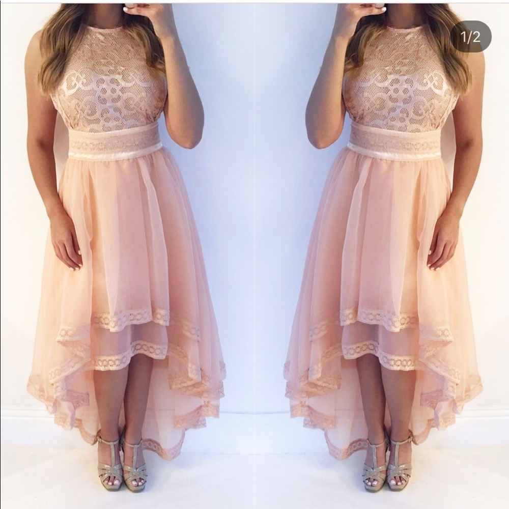 Peach colored high low lace dress.